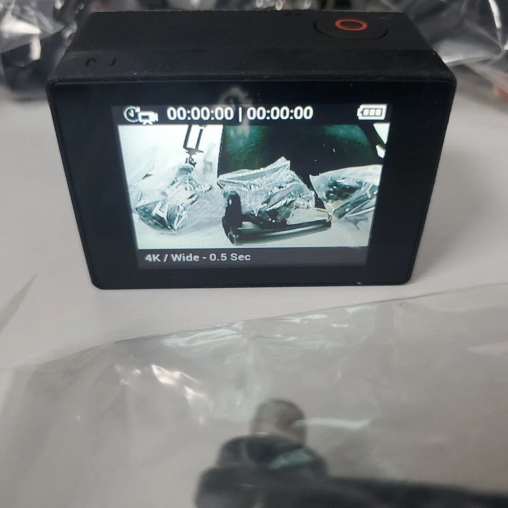 GoPro Hero4, Two Batteries, And Accessories Lot. Mounts, Body And Head Harness
